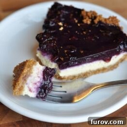 Blueberry Cheesecake Pie with a bite taken out