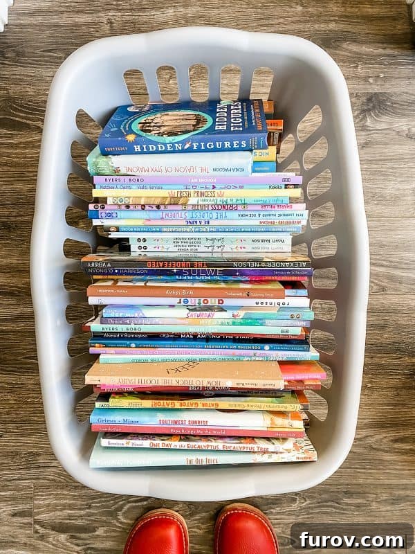 A cozy gray woven basket overflows with a vibrant collection of diverse children's books, symbolizing cultural outreach and literacy efforts.