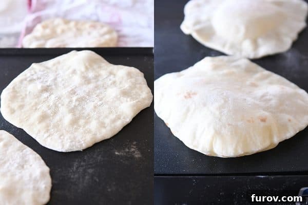 Flatbread cooking on a hot griddle, showing bubbles forming on the surface.
