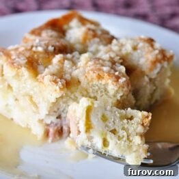 A smaller image of the Rhubarb Streusel Cake, garnished with warm vanilla sauce, serving as a visual reference for the recipe card.