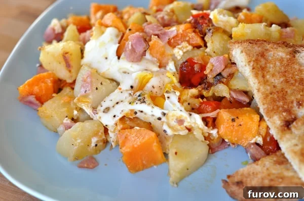 Egg and potato hash on a plate.