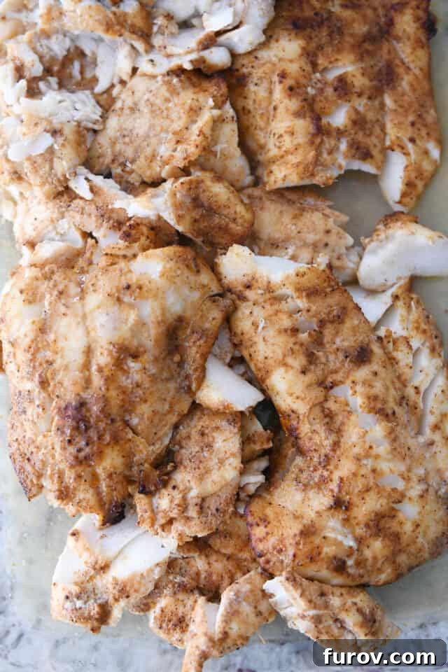 Cooked white fish with seasonings for the best fish tacos.