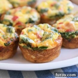 five hash brown veggie egg cups on white platter