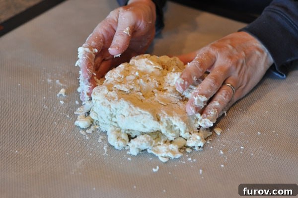 pie dough about to be rolled out, showing its shaggy appearance.