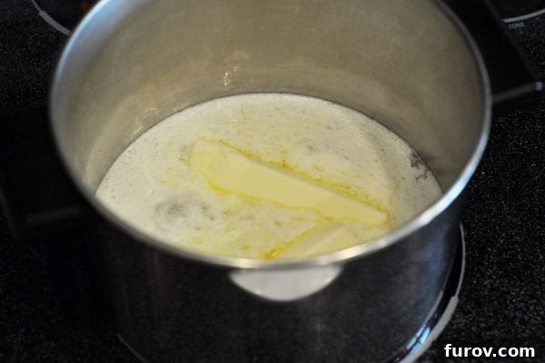 Golden butter melting gently in a saucepan, forming the base of the delicious caramel.