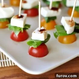 White platter with Caprese skewers