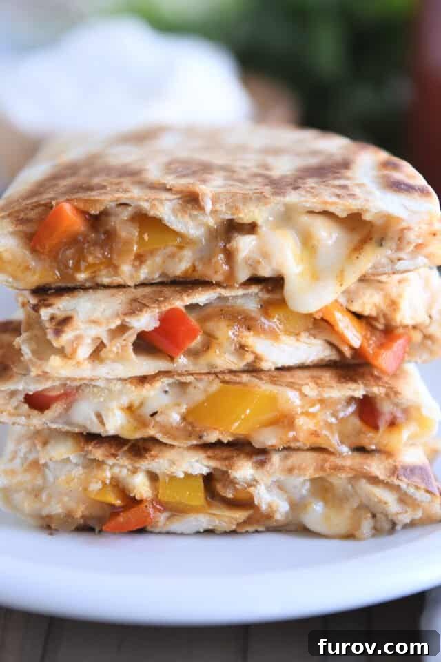 Crispy Chicken Quesadillas: A Culinary Delight 2 Four golden-brown chicken quesadillas stacked on a pristine white plate, garnished with fresh cilantro.