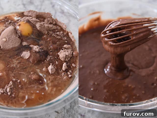 A whisk mixes dark, luscious chocolate cake batter in a clear glass bowl, demonstrating the smooth texture achieved after combining all ingredients.