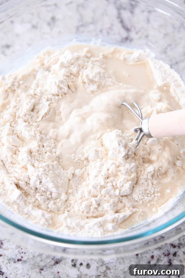 Mixing sourdough bread dough with danish dough whisk.