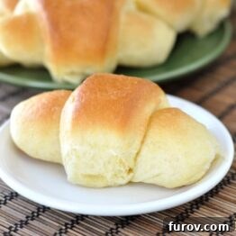 Golden Cornmeal Butter Crescents 4 Golden brown crescent rolls ready to be enjoyed, highlighting the buttery crust and inviting texture.