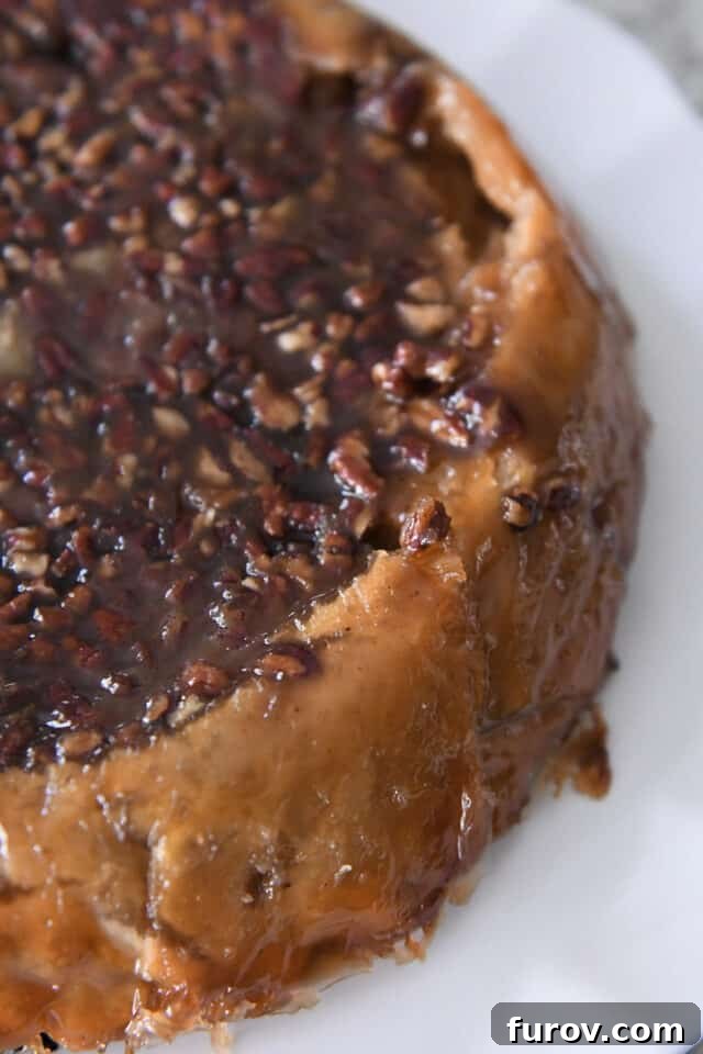 Caramel pecan layer on top of apple pie.