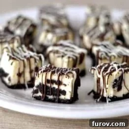 Delicious Oreo Cheesecake Bites with chocolate drizzle, ready for serving.