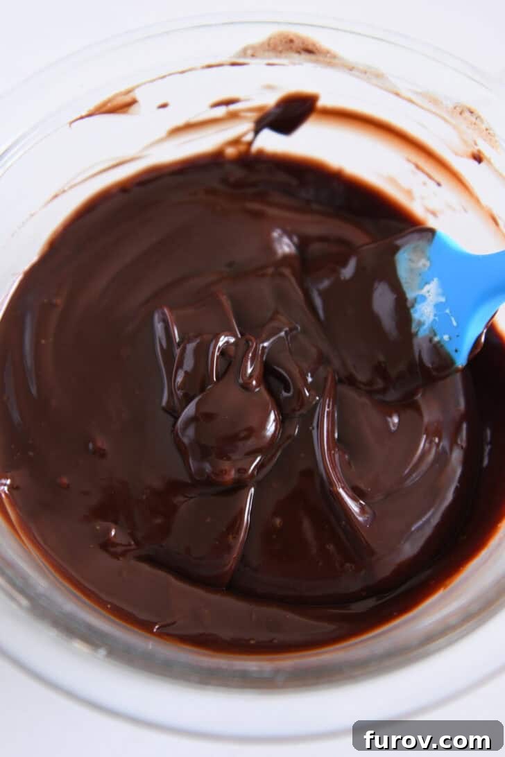 Top down view of glass bowl filled with chocolate ganache.
