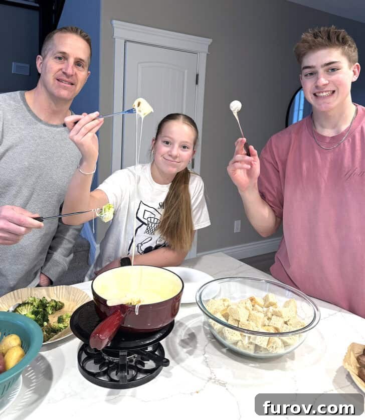 Family eating cheese fondue.