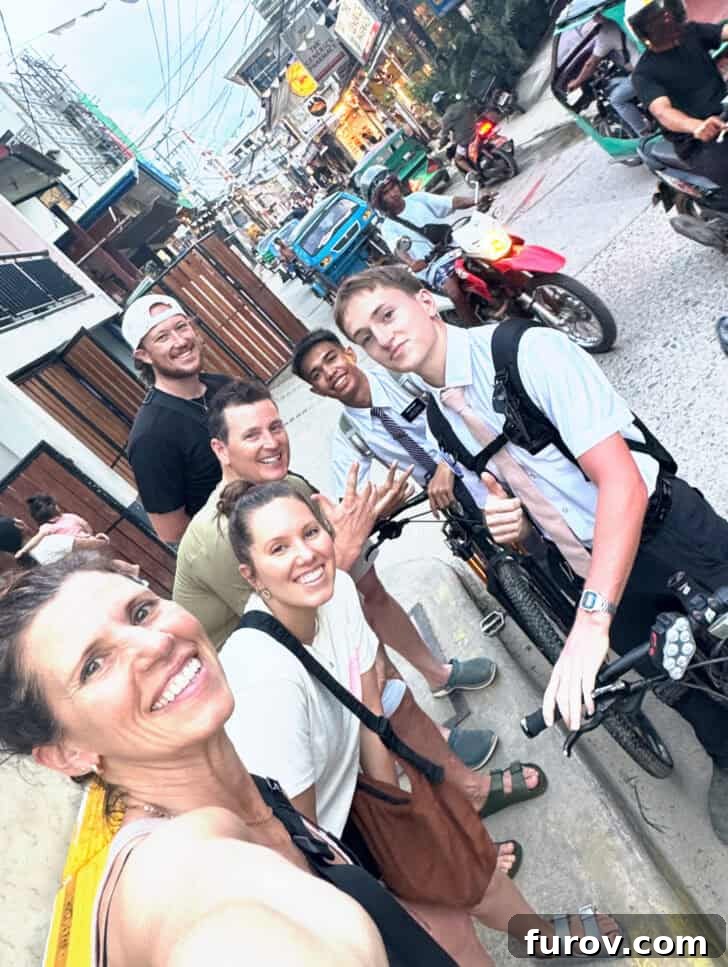 Picture of two missionaries on bikes with family.