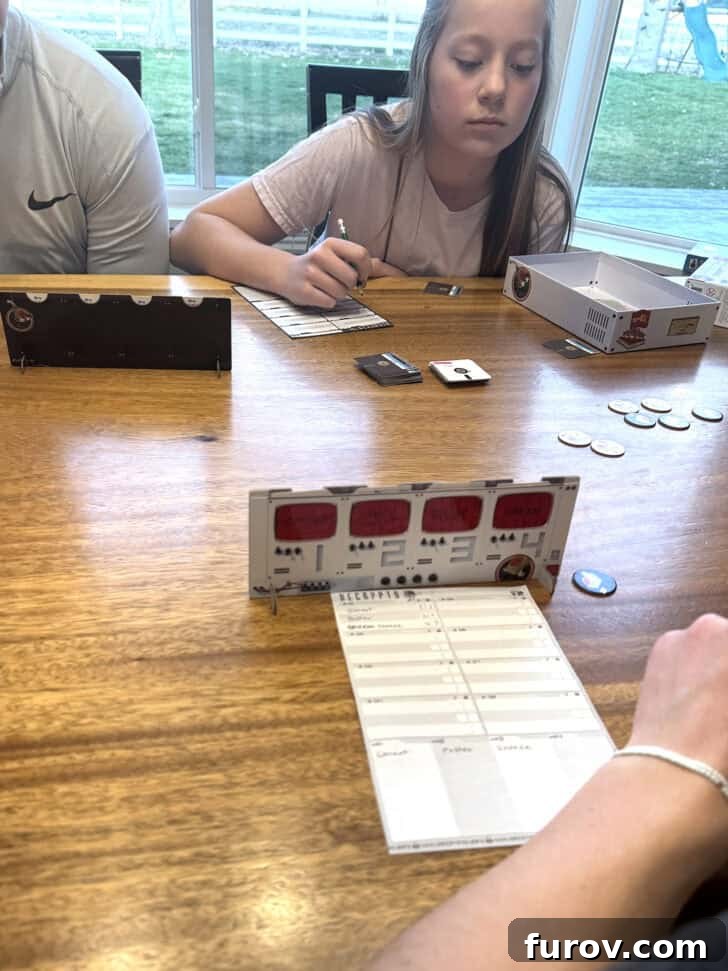 Playing Decrypto game as a family.