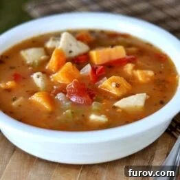 A close-up of the delicious Spicy (Or Not) Chicken and Sweet Potato Soup, ready to be served.