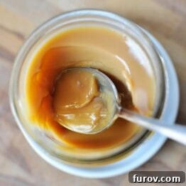Whip Up Your Own Dulce de Leche 6 A small glass jar filled with luscious, golden slow cooker dulce de leche, ready to be enjoyed.