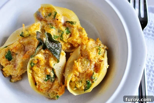 Golden Sage Brown Butter Butternut Stuffed Shells 2 Top view of butternut squash and sage filled jumbo pasta shells, drizzled with browned butter and garnished with fresh sage.