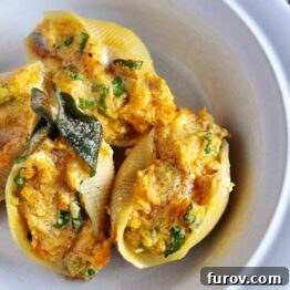 A plate of butternut squash stuffed shells with sage browned butter sauce.