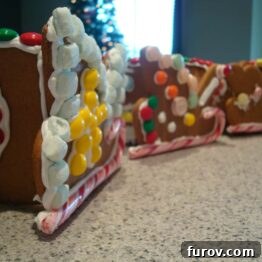 Close-up of a meticulously decorated gingerbread sled, brimming with an assortment of colorful candies.