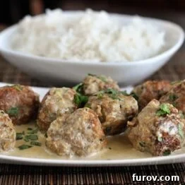 Vibrant Thai Green Curry Meatballs 5 A vibrant close-up of Thai Green Curry Meatballs, rich with sauce and ready to be served.