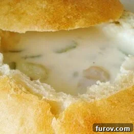 A bowl of creamy Boston Clam Chowder, ready to be served and enjoyed.