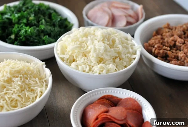Six white bowls full of various colorful pizza toppings including cheese, vegetables, and meats.
