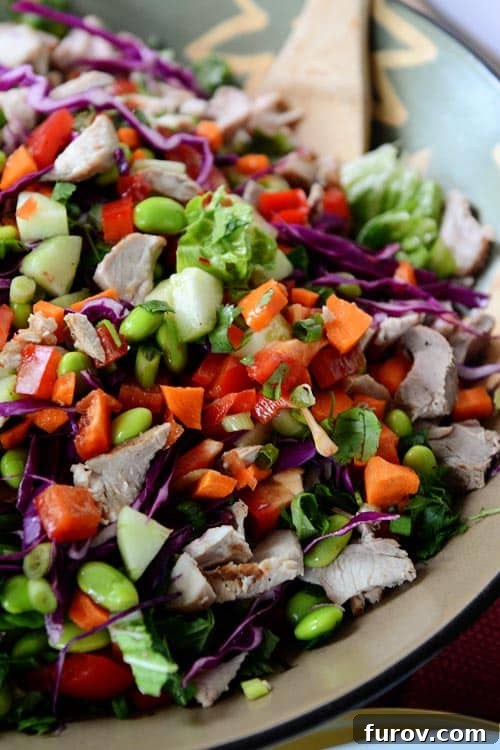 Ultimate Thai Crunch: Sweet Heat Salad 4 A large bowl full of a colorful veggie-laden Thai crunch salad.