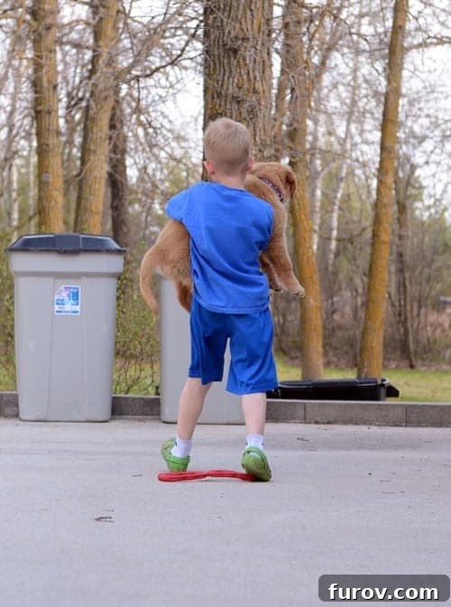 Saturday Survival: Mastering Summer Break 3 A tender moment captured between a young boy and a fluffy puppy, with the child gently holding the small dog, symbolizing the joy of pet ownership and outdoor companionship.