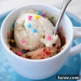 A delicious vanilla funfetti mug cake, ready to eat.