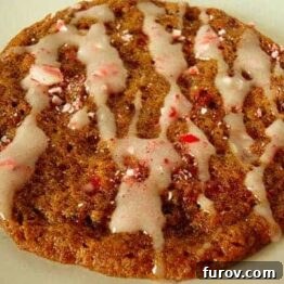 Peppermint Molasses Cookies with crushed candy canes and white icing