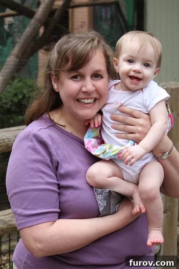 Christina at her heaviest in 2011, holding a baby girl, symbolizing the start of her health journey and the challenges she faced as a mother.