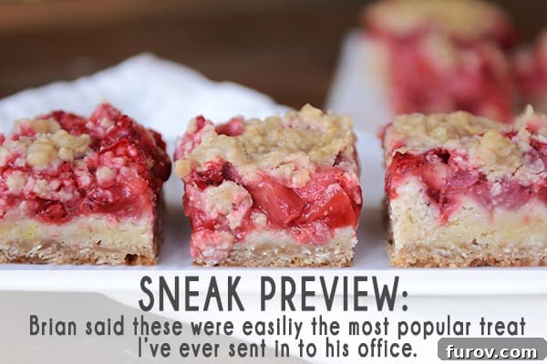 Strawberry shortcake bars, perfectly portioned and arranged in neat rows on a pristine white platter.