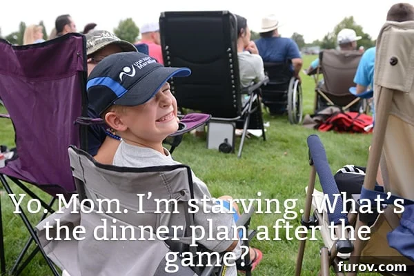 Dinner Done: When Youre Too Busy or Tired to Cook 2 A little boy sitting on a camp chair smiling brightly, enjoying the outdoors.