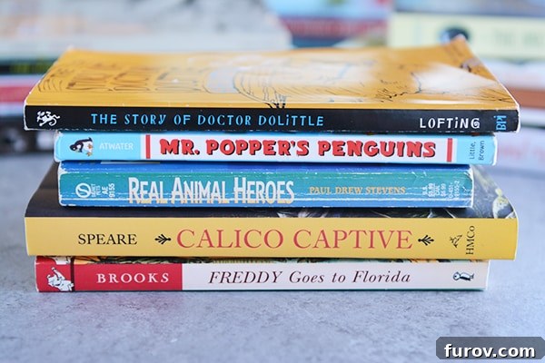 Unleash Imagination: Our Favorite Summer Reads for Kids 6 A colorful stack of five kids' chapter books on a kitchen countertop.