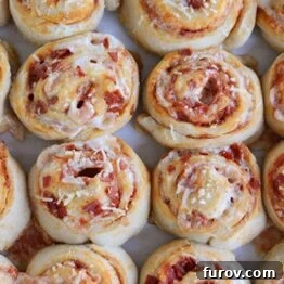 Homemade Pepperoni Pizza Rolls on a baking sheet