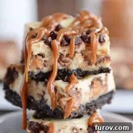 A top-down view of Caramel Snickers Cheesecake Bars, showcasing their rich, inviting textures and vibrant caramel drizzle.