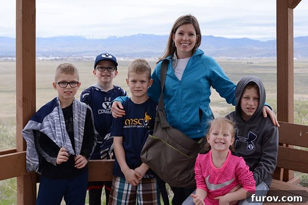 Essential Suncare Updates for Skin Cancer Prevention 2 A mom standing with her five kids on a balcony.