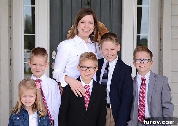 Essential Suncare Updates for Skin Cancer Prevention 5 A mother and her five kids standing in front of their house dressed in Sunday best.