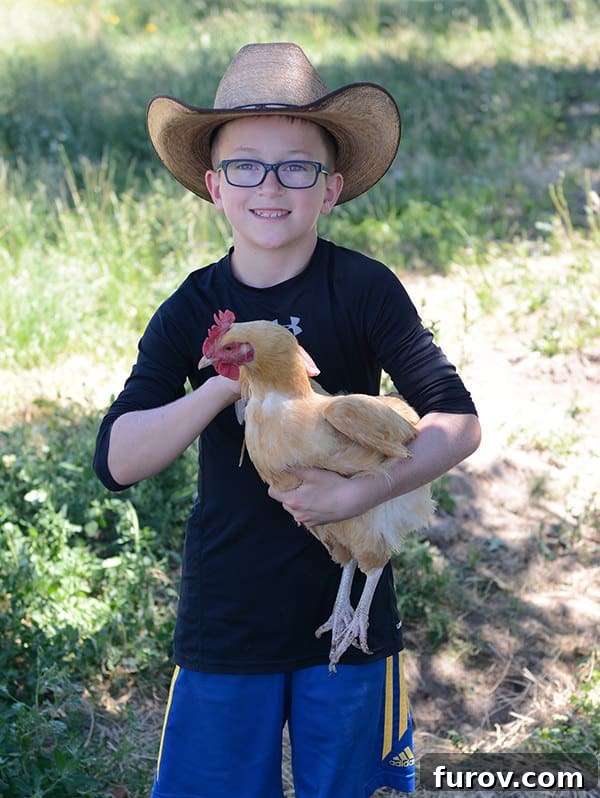 Essential Suncare Updates for Skin Cancer Prevention 6 A little boy in a cowboy hat holding a chicken.