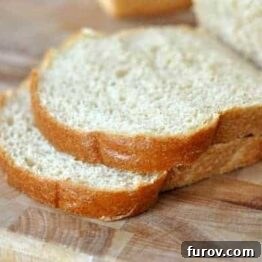 A close-up image of Darcy's freshly baked whole wheat bread, sliced and showing a tender, even crumb.