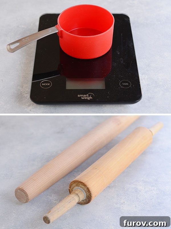 Kickstart Your Pie Making: Essential Tools and Ingredients 5 A red measuring cup resting on a digital kitchen scale, with two wooden rolling pins in the background, highlighting precision in baking.