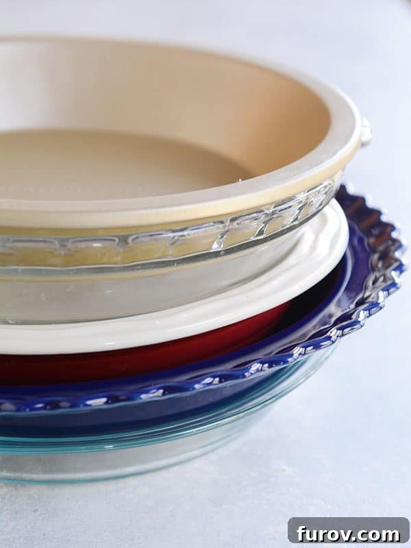 Kickstart Your Pie Making: Essential Tools and Ingredients 7 A stack of various colors and sizes of pie dishes, showcasing different materials and aesthetics.