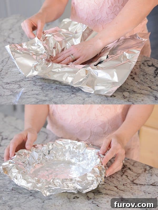 Tinfoil getting put into a pie dish.