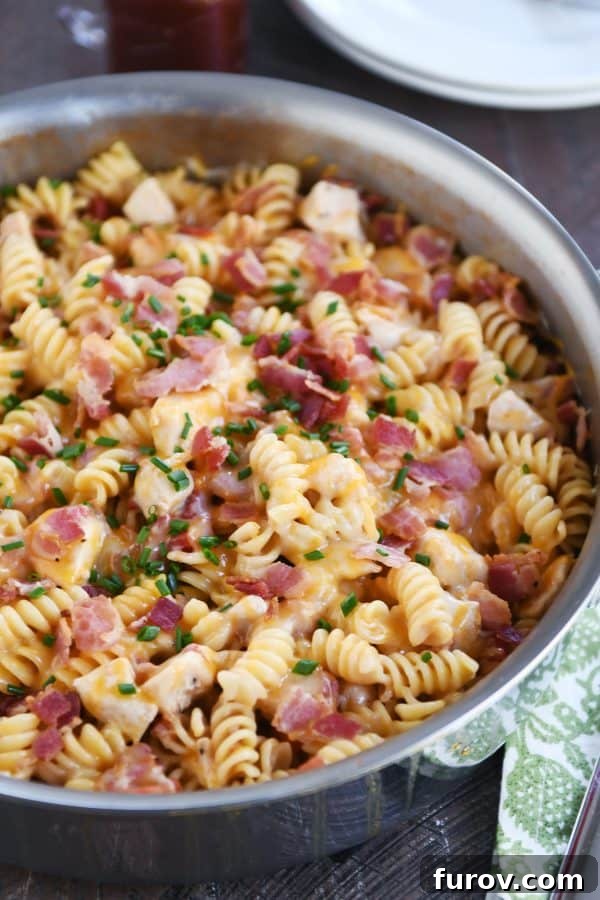 Monterey BBQ chicken pasta in a big skillet, ready to serve.