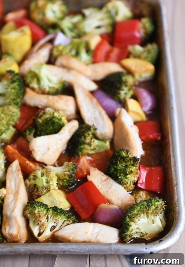 Teriyaki chicken sheet pan dinner with broccoli, peppers and squash.