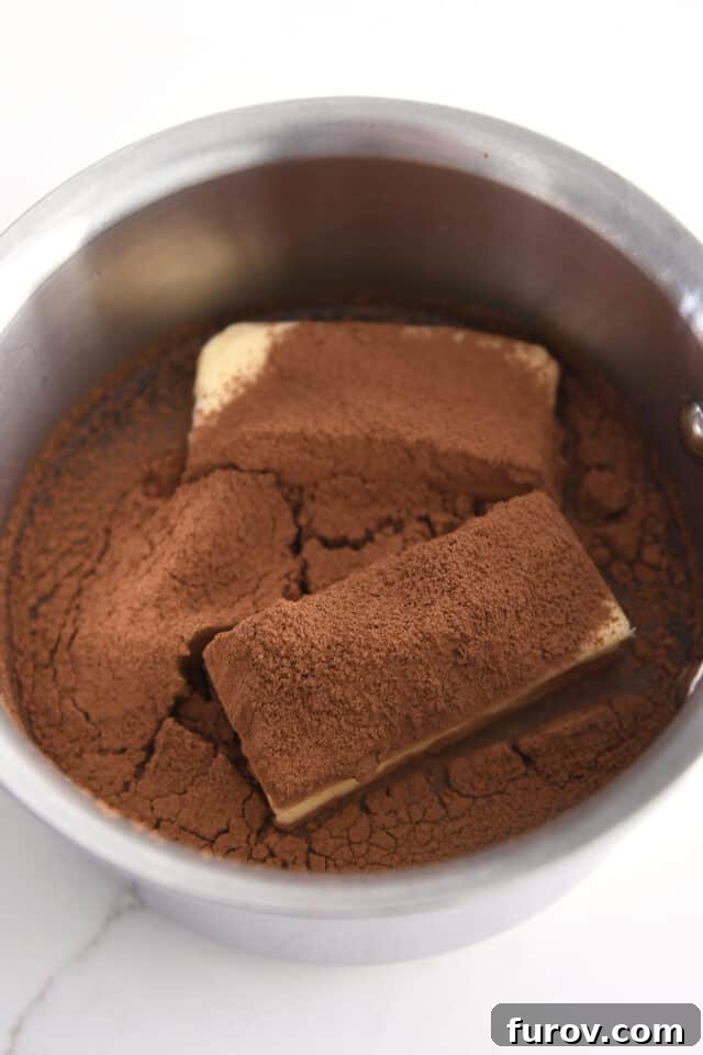 Butter, cocoa powder and water in small saucepan. Melting butter with cocoa for Texas Sheet Cake batter.