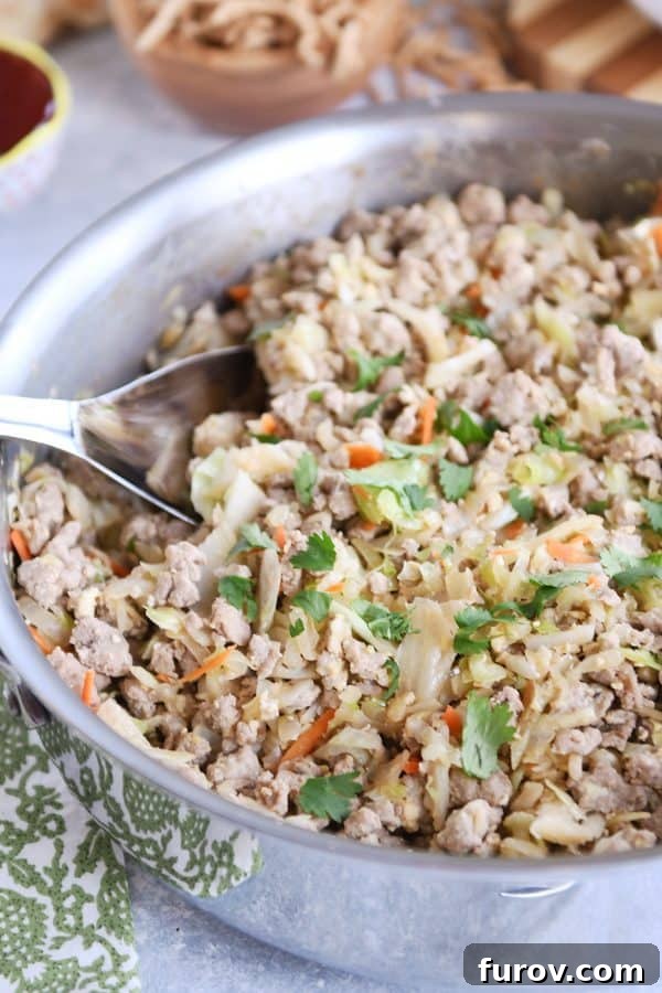 One-Pan Egg Roll Bowl 3 Egg roll skillet meal in stainless steel pan.