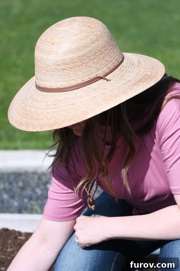 Sun Smart: A Skin Cancer Update & My Favorite Protective Gear 6 A woman wearing a wide-brimmed sun hat, demonstrating sun protection attire